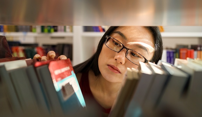 Young adult in library